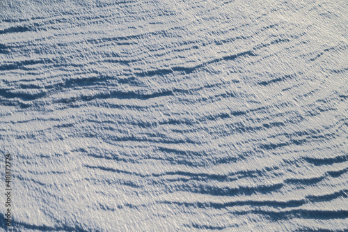 Natural abstract background. Snow surface.