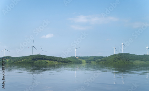 Wind power plants on the hills - green energy.