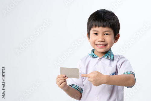 Asian boy holding paper credit card mockup for identification or bank © bonnontawat