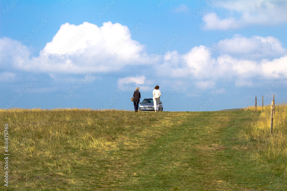 Spacious meadow on the mountains Zlatibor, Serbia. Two older women enjoy a walk in beautiful nature. Spacious meadow on the mountains Zlatibor, Serbia. Two older women enjoy a walk in beautiful nature.