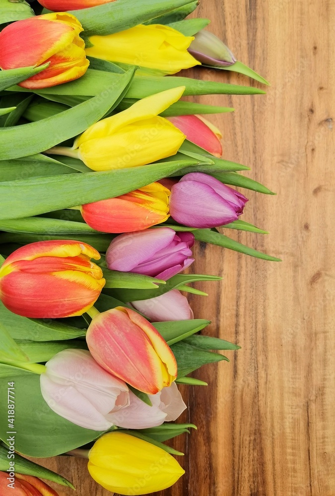 Spring tulips bouquet on wooden background. Spring tulips bouquet on wooden background.