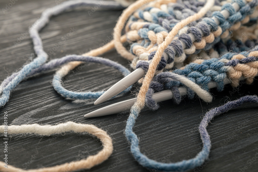 Photo of colored balls from knitting yarn. Knitting supplies close-up. Knitting-women's needlework. 