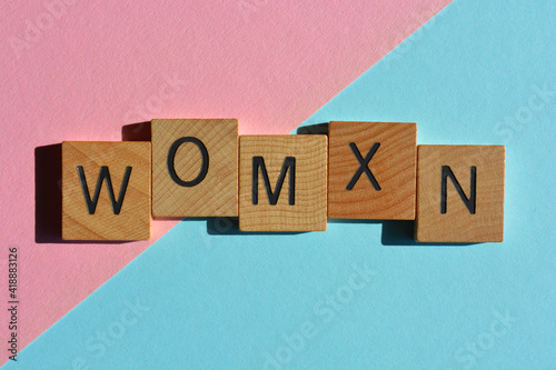 Womxn, word isolated on pink and blue background