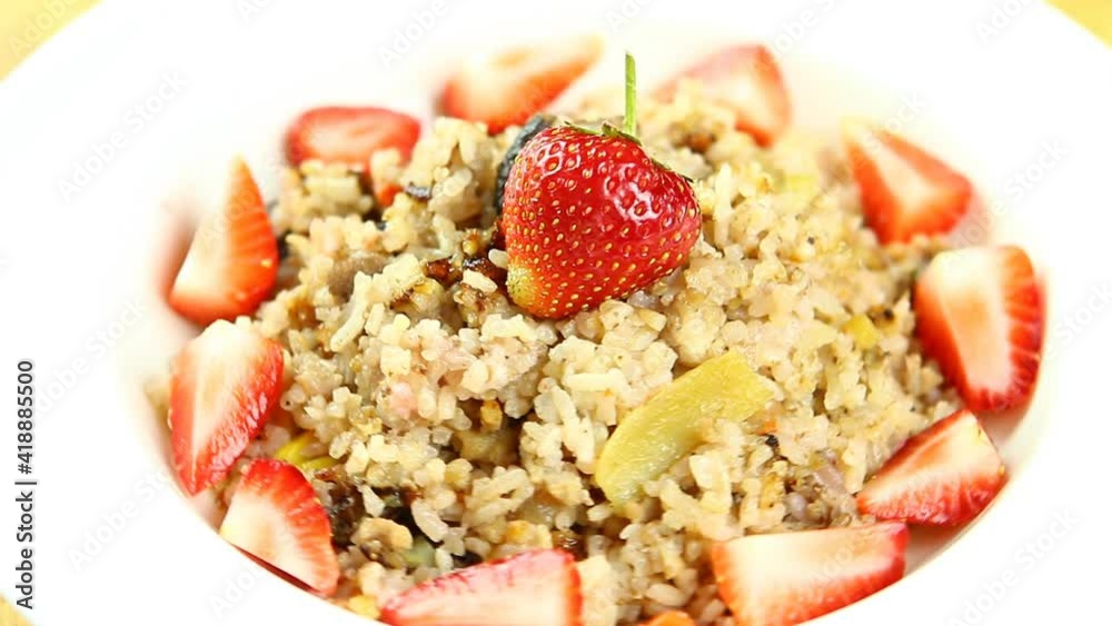 Baked rice with strawberries in plate, in studio Chiangmai Thailand Baked rice with strawberries in plate, in studio Chiangmai Thailand