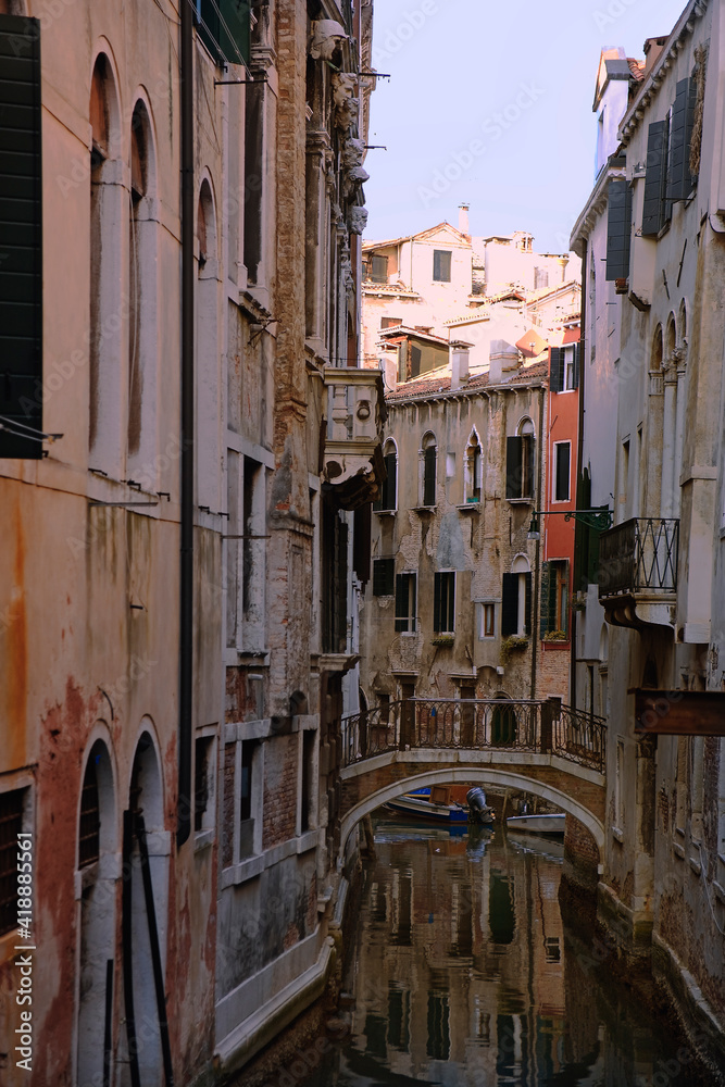 A shady Venetian backwater and typical Venetian bridge: Rio della Madoneta, San Polo, Venice, Italy