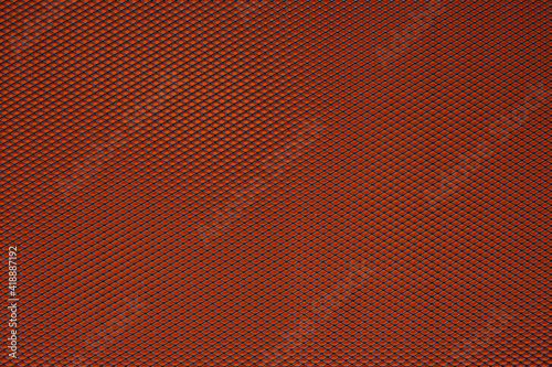 Abstract closeup of metallic background with orange background © Fernando