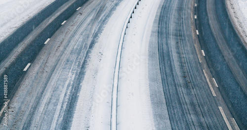 Highway with not cars, covered in snow and ice on a cold winters day.
