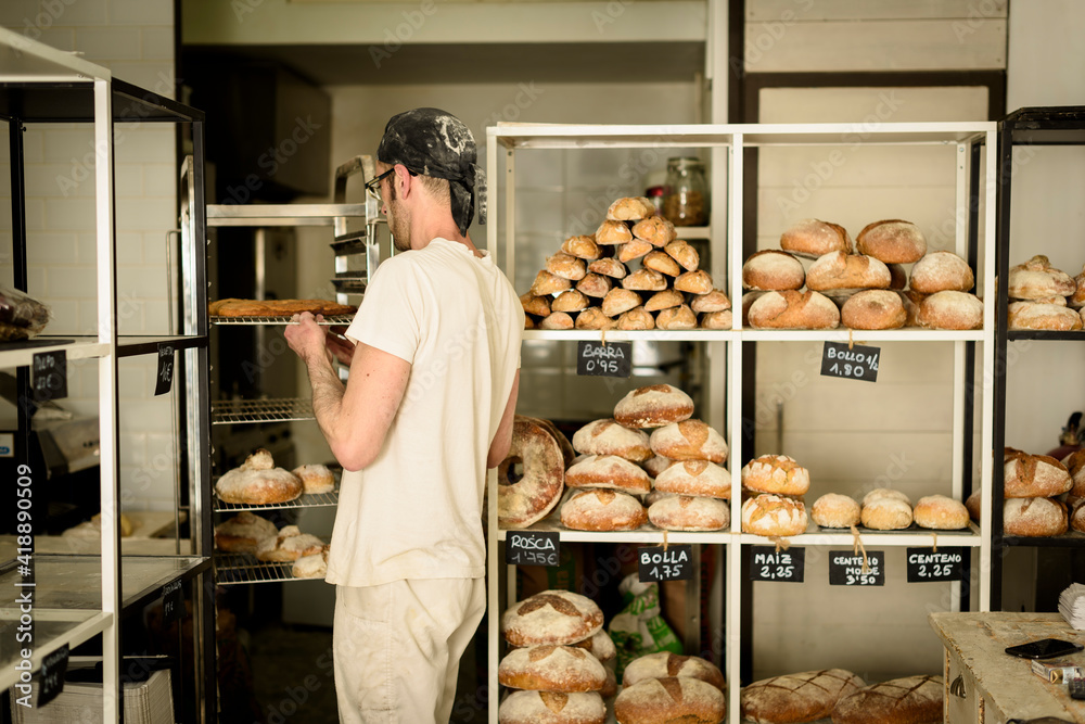 Young baker working at his bakery