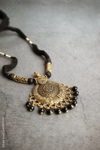 Indian traditional gold necklace with black beads