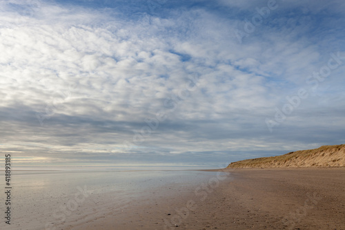 Vast empty sand beach in north devon, england on a sunny day