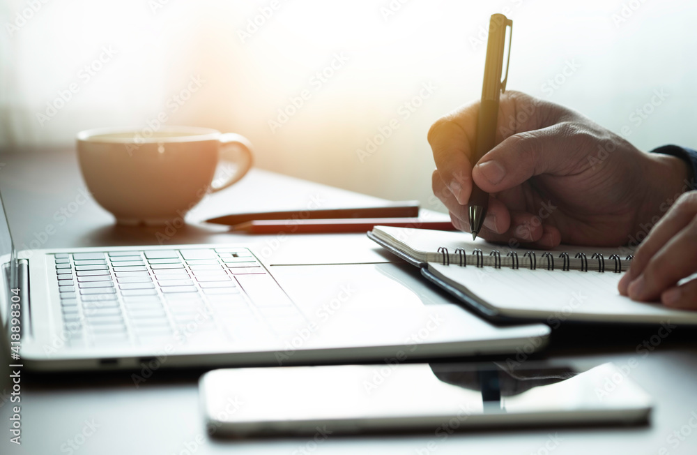 man hand using writing pen memo on notebook paper or letter, diary on table desk office. Workplace for student, writer with copy space. business working and learning education concept. man hand using writing pen memo on notebook paper or letter, diary on table desk office. Workplace for student, writer with copy space. business working and learning education concept.