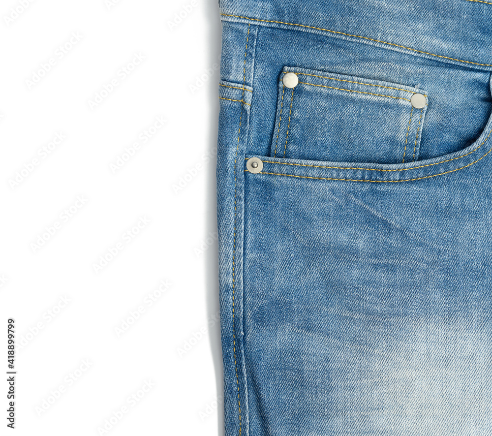 fragment of blue men's jeans with a pocket on a white background fragment of blue men's jeans with a pocket on a white background