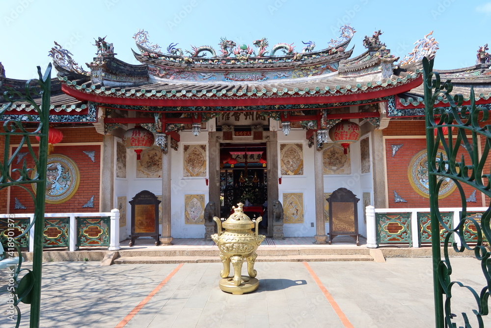 Hoi An, Vietnam, March 8, 2021: Main facade seen from the inner courtyard of a Taoist Temple in Hoi An, Vietnam