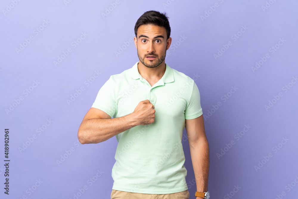 Young handsome man isolated on purple background pointing to oneself Young handsome man isolated on purple background pointing to oneself
