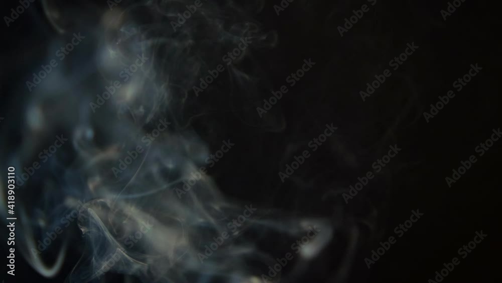 Abstract white smoke. Smoke, a cloud of cold fog on a black background of a fire, a hookah, a fire. Floating fog. Slow motion shooting of 240 Abstract white smoke. Smoke, a cloud of cold fog on a black background of a fire, a hookah, a fire. Floating fog. Slow motion shooting of 240