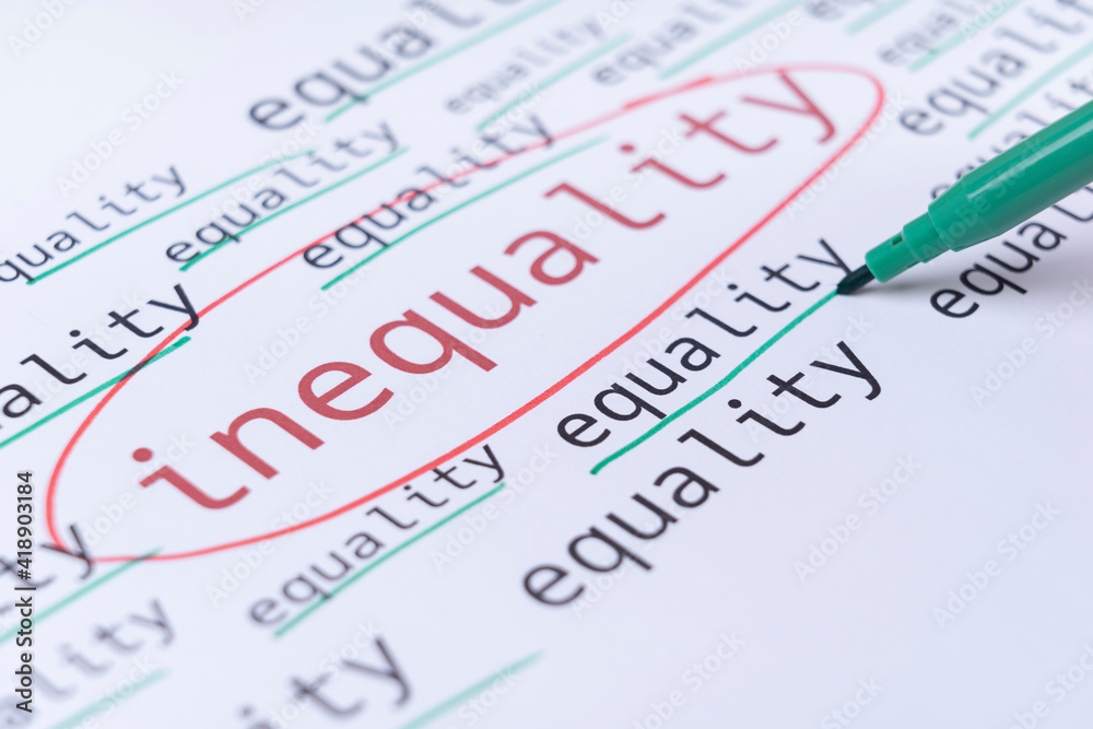 Gender equality concept, hand underlines with green marker the word EQUALITY. Selective focus Gender equality concept, hand underlines with green marker the word EQUALITY. Selective focus
