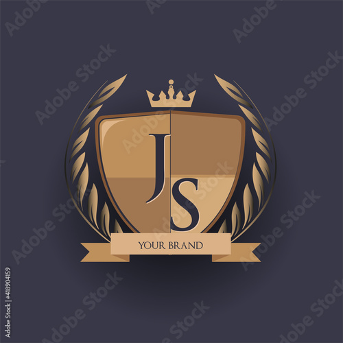 initial letter JS logotype colored brown and gold isolated with shield, crown and laurel design, logo for college and sport club.