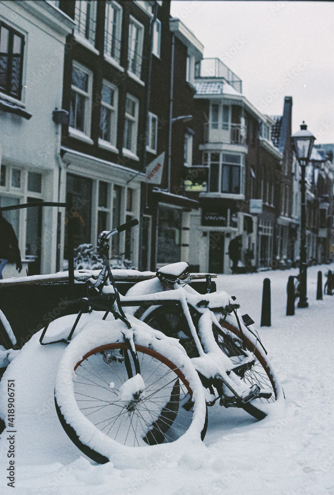 Film photo of a bicycle covered in snow in the Netherlands