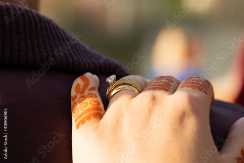 Beautiful wedding ring with henna traditional hand work