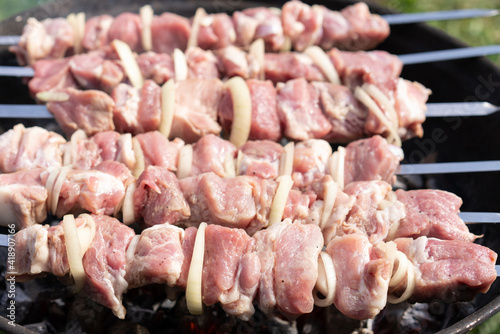 Step by step. Cooking pork shashlik on skewers on the grill. Step 1