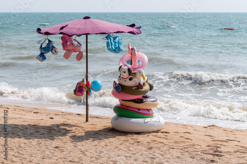 Colorful floats and inflatable toys shop on the beach