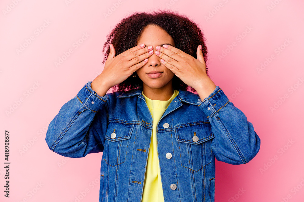 Young african american mixed race woman isolated afraid covering eyes with hands. Young african american mixed race woman isolated afraid covering eyes with hands.