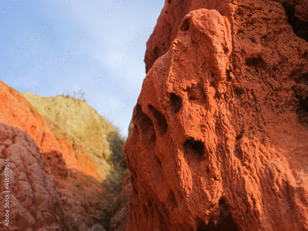Cliff of red clay closeup