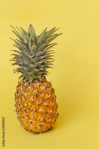 Pineapple isolated on yellow background