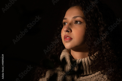 PORTRAIT OF A TEENAGER SERIOUSLY LOOKING AWAY	