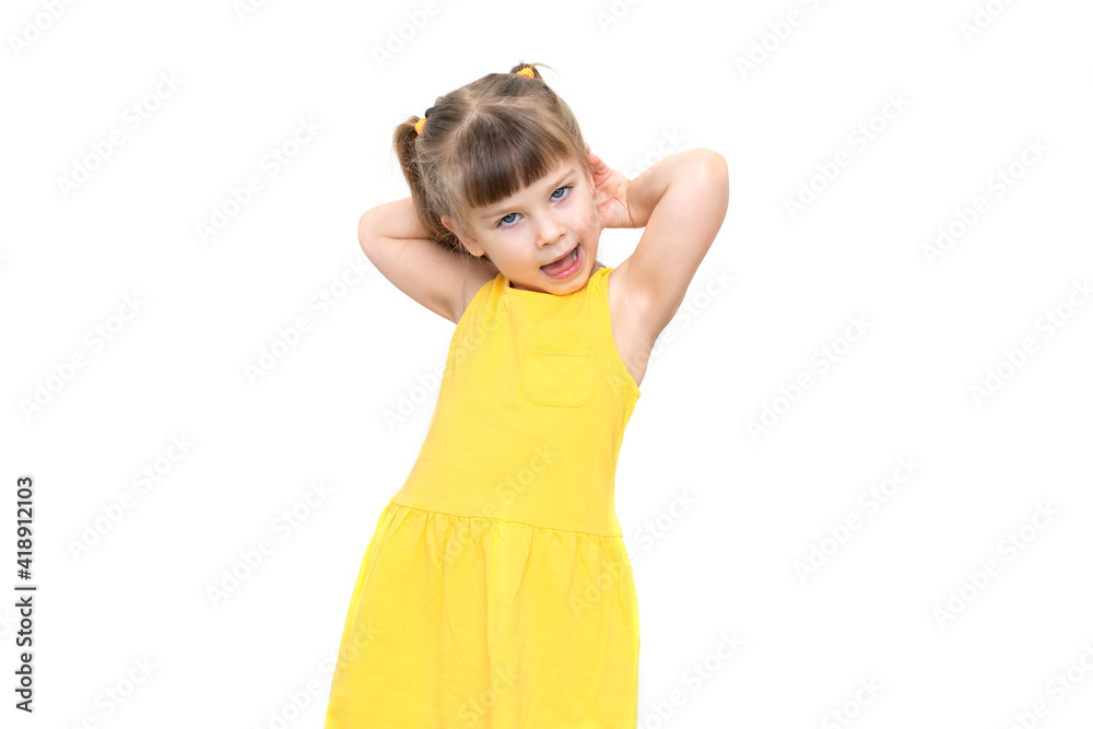 emotional little girl in yellow dress posing on white background