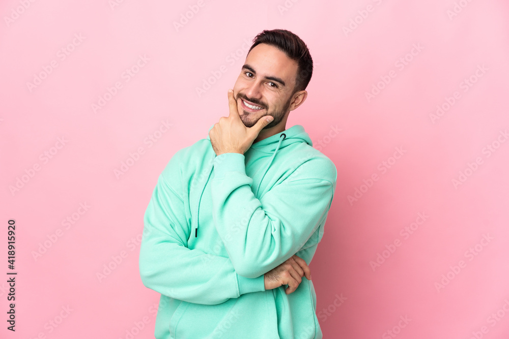 Young caucasian handsome man isolated on pink background happy and smiling Young caucasian handsome man isolated on pink background happy and smiling