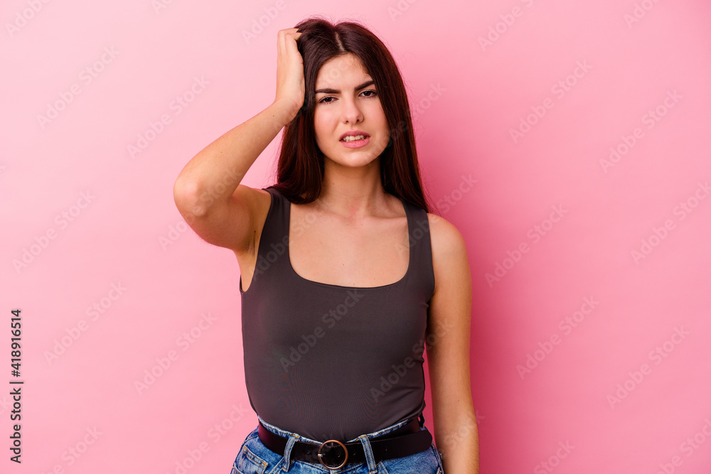 Young caucasian woman isolated on pink background forgetting something, slapping forehead with palm and closing eyes. Young caucasian woman isolated on pink background forgetting something, slapping forehead with palm and closing eyes.