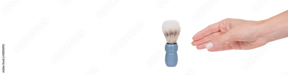 Hand with blue shaving brush, isolated on white background. Hand with blue shaving brush, isolated on white background.