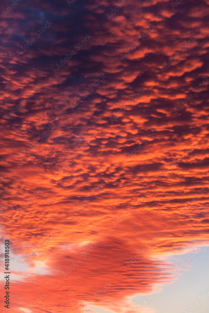 dramatic close up fiery red summer clouds