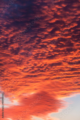 dramatic close up fiery red summer clouds