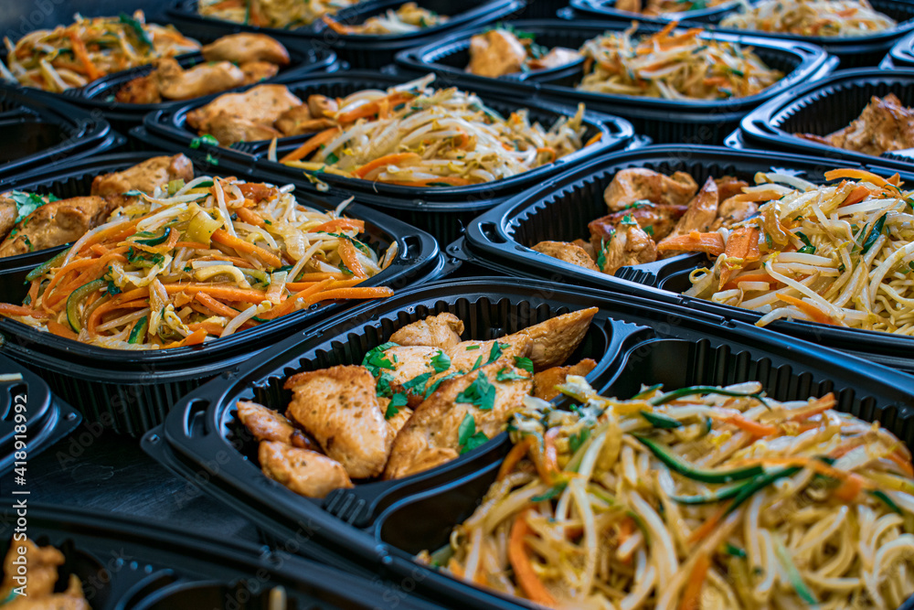 Chinese takeaway, chicken and vegetable wok in plastic containers, takeaway