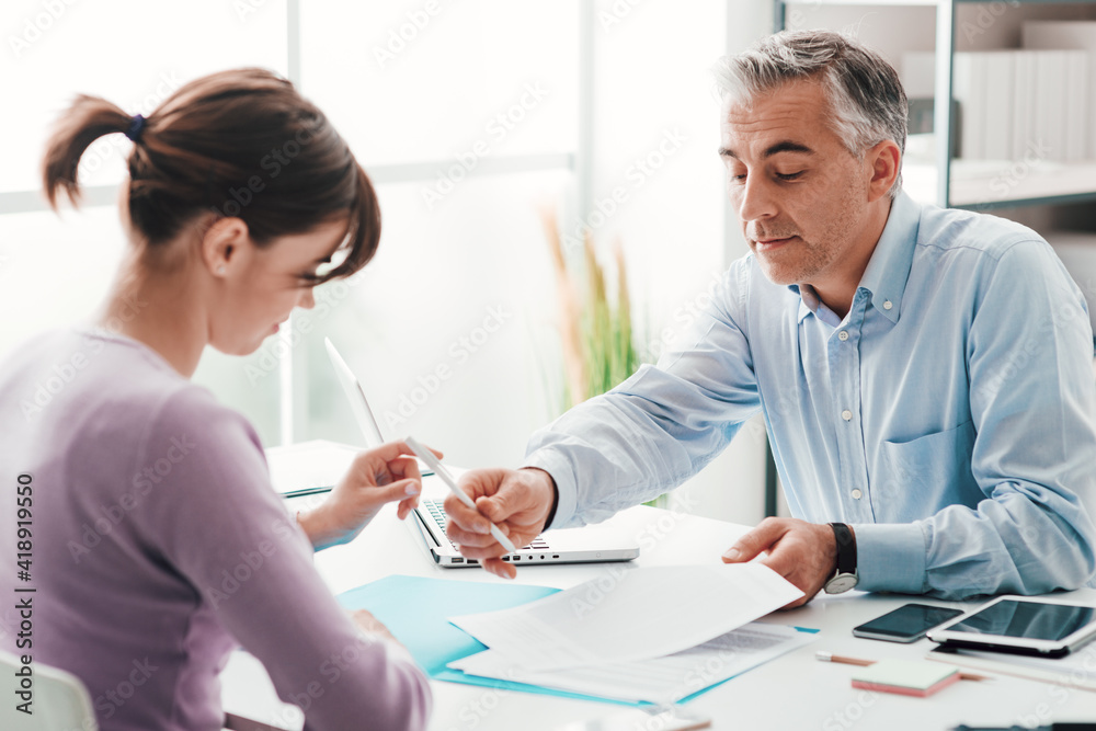 Woman signing a contract Woman signing a contract