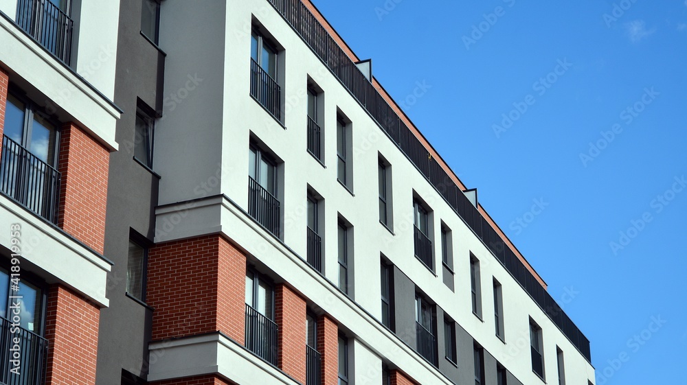 Cityscape with facade of a modern residential building. Modern European residential apartment building. Cityscape with facade of a modern residential building. Modern European residential apartment building.