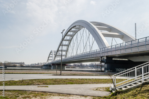 Novi Sad, Serbia - March 08. 2021: Zezelj bridge on river Danube in Novi Sad Serbia. The prospect of built New Zezelj Bridge viewed from the Petrovaradin side of the promenade.