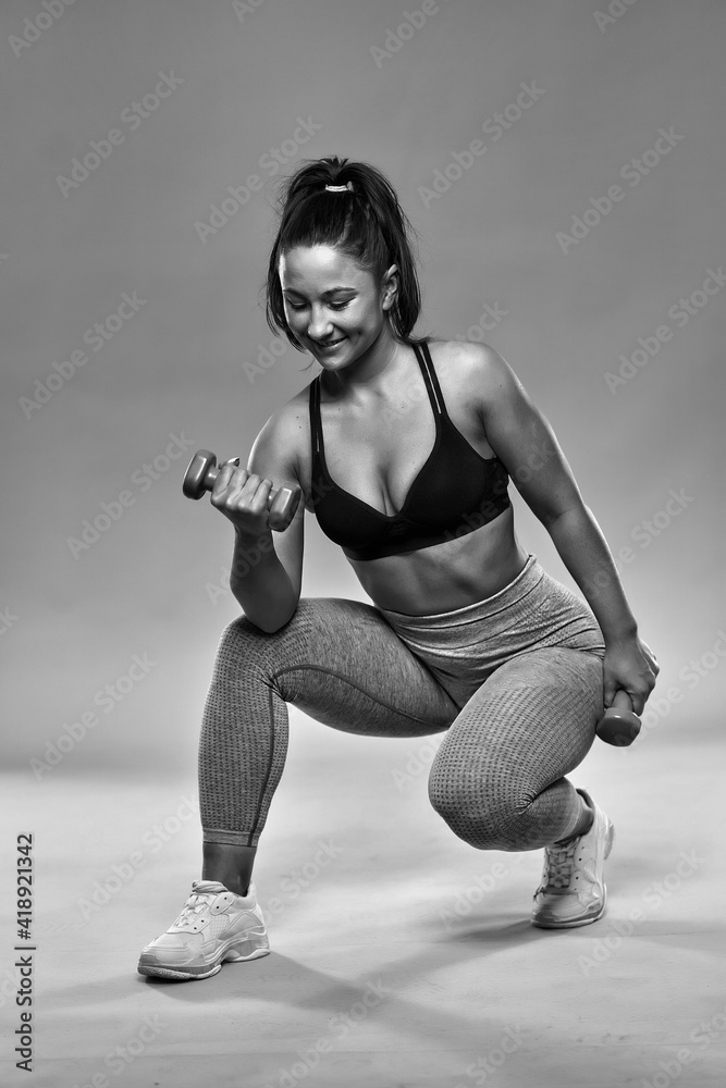Plus size woman doing fitness exercises