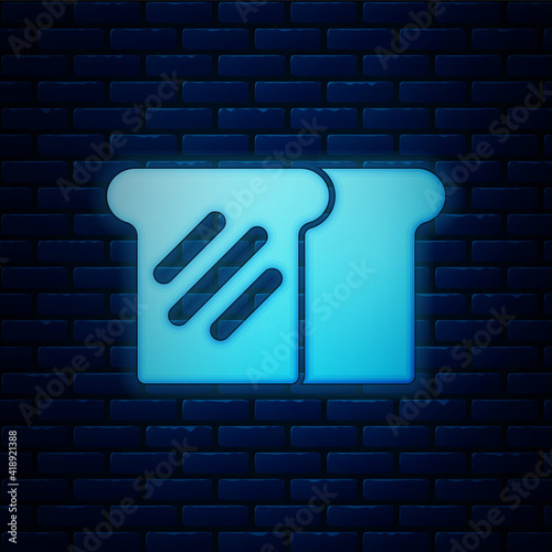 Glowing neon Bread toast for sandwich piece of roasted crouton icon isolated on brick wall background. Lunch, dinner, breakfast snack. Vector.