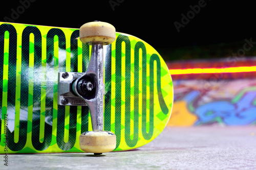 Close-up shot Skateboard isolated with skateparck on background