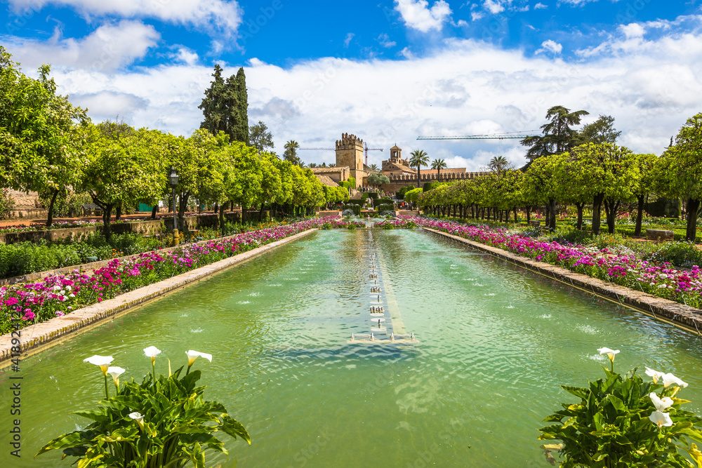 Cordoba, Andalusia, Spain - April 20, 2016: The popular gardens of Alcazar de los Reyes Cristianos in Cordoba, Andalusia, Spain. - obrazy, fototapety, plakaty 