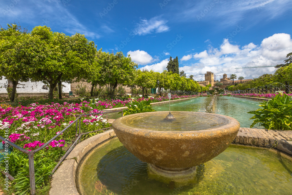 Cordoba, Andalusia, Spain - April 20, 2016: Close up of fountain in the popular gardens of Alcazar de los Reyes Cristianos, Andalusian city of Cordoba, Spain.