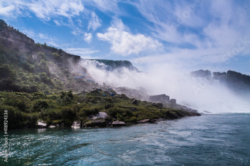 dramatic and spectacular image of the Niagara Falls taken during summer.