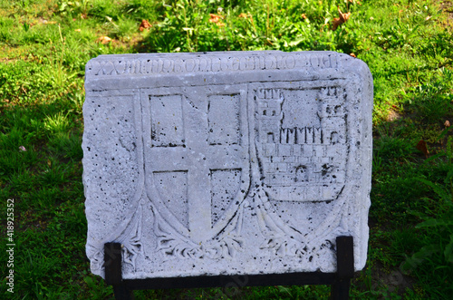 Cross and castle symbols on White marble, Castle and cross engraved on White stone. photo