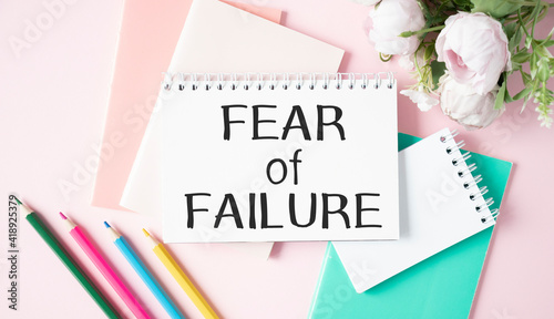 text fear of failure , isolated white background with printer and folders.business concept