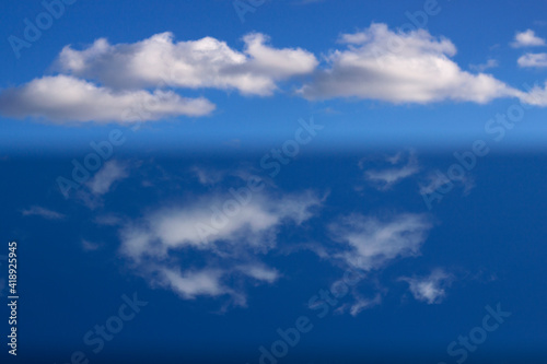 unfocused background with different parts of blue sky with clouds - abstract nature drawing