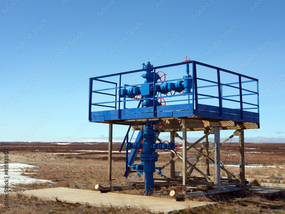 Oil and gas industry. Gas exploration well. Beautiful sunny spring day in the polar tundra Oil and gas industry. Gas exploration well. Beautiful sunny spring day in the polar tundra