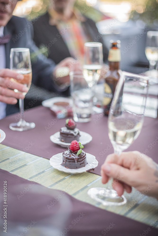 People having dessert and wine in restaurant